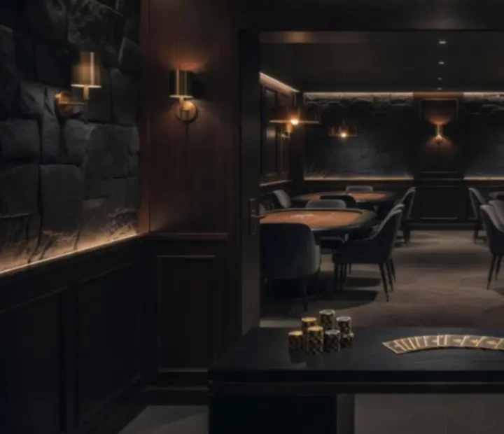 Signature card room entrance at Shufflean Dember with warm lighting, poker tables and dining details